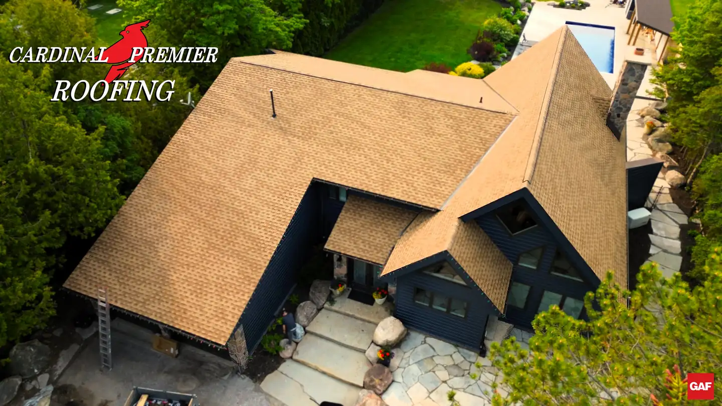 Aerial view of a home with a newly installed Cardinal Premier Roofing roof