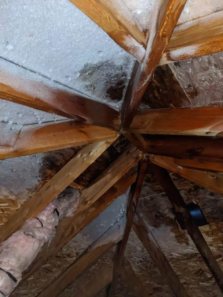 Roof repair work in progress on a residential roof